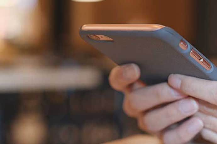 closeup of holding mobile device.